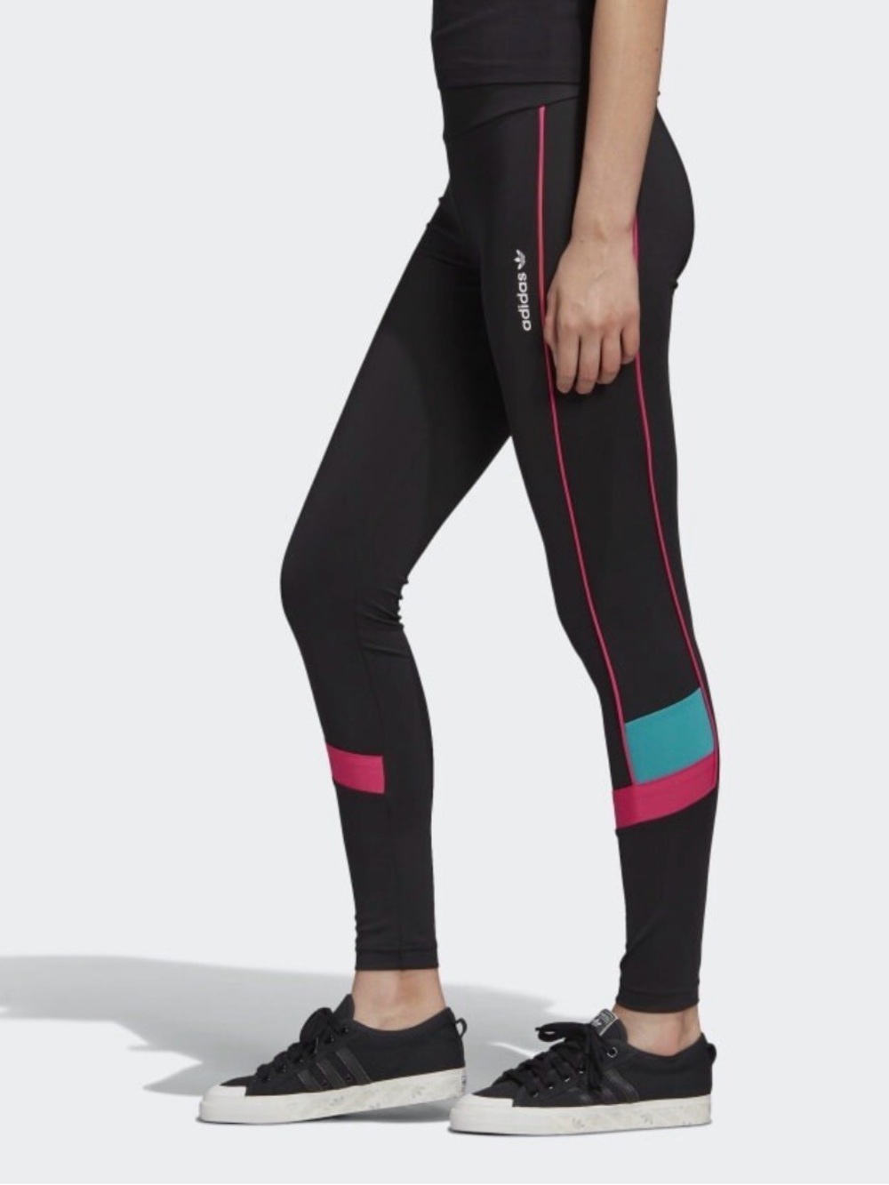 Adidas Originals Tech leggings feature vibrant pink piping and retro-inspired